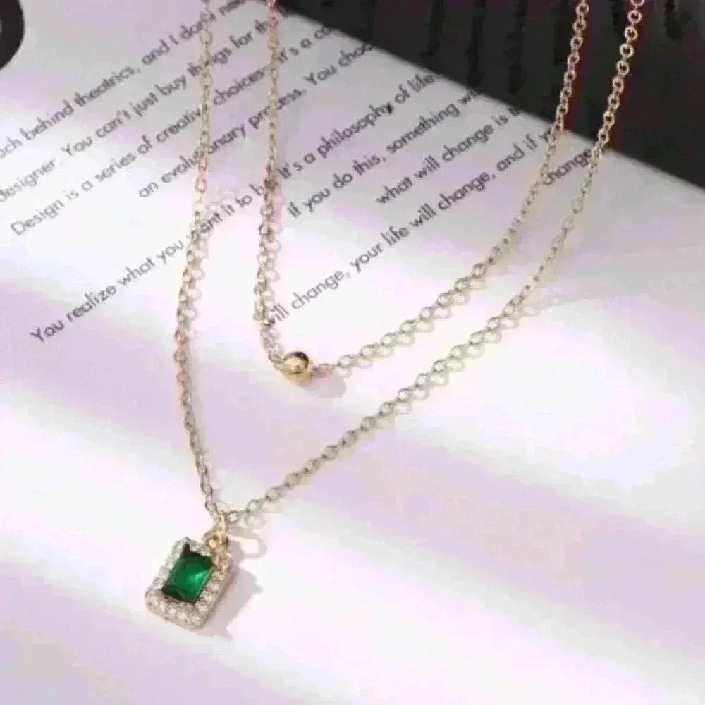 Layered Gold Necklace with Emerald Stone Pendant